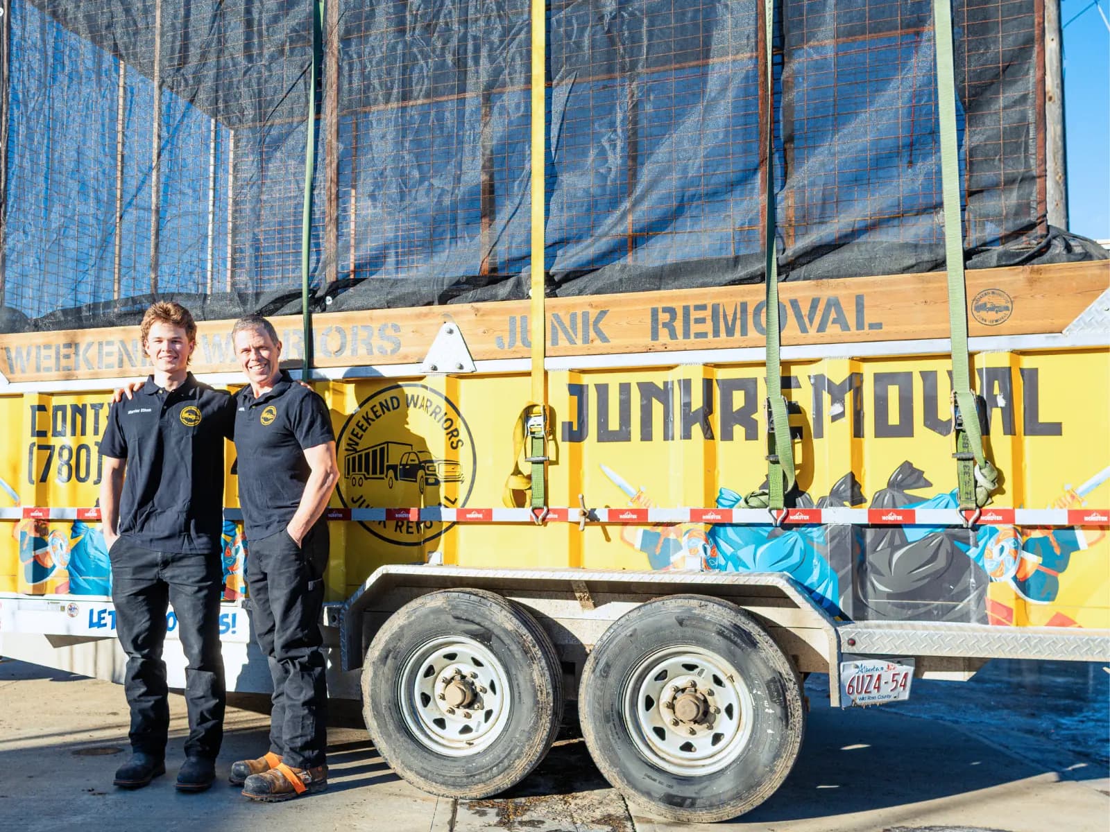 Ethan and Paul Caines standing by their truck