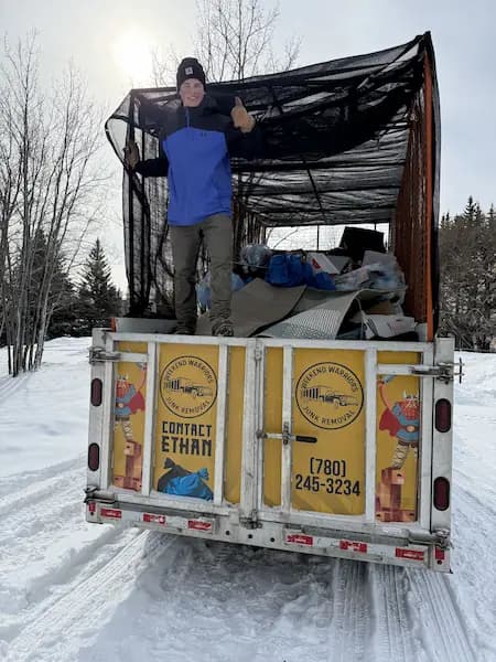 Weekend Warriors truck dumping a load at the junkyard